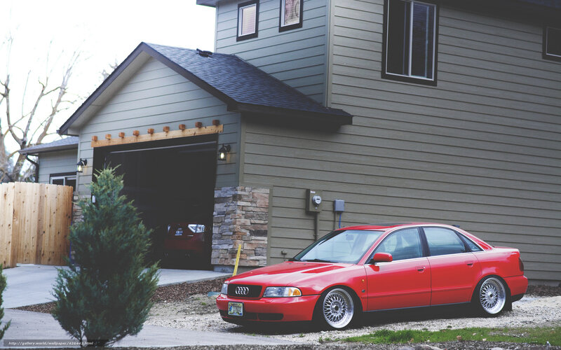 Red Audi in front of house