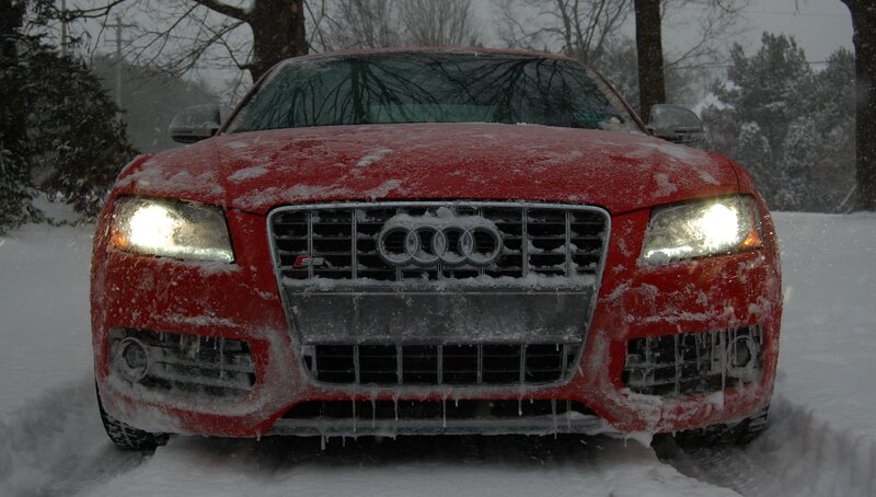 Red Audi in snowy weather