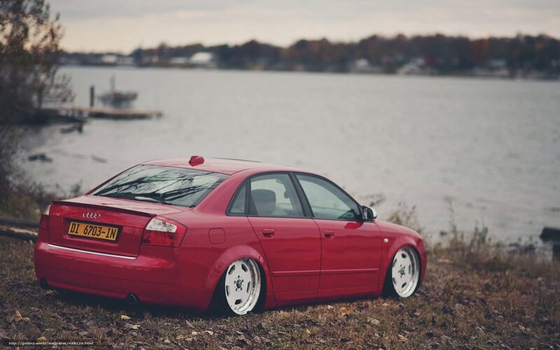 Red Audi on lakeside