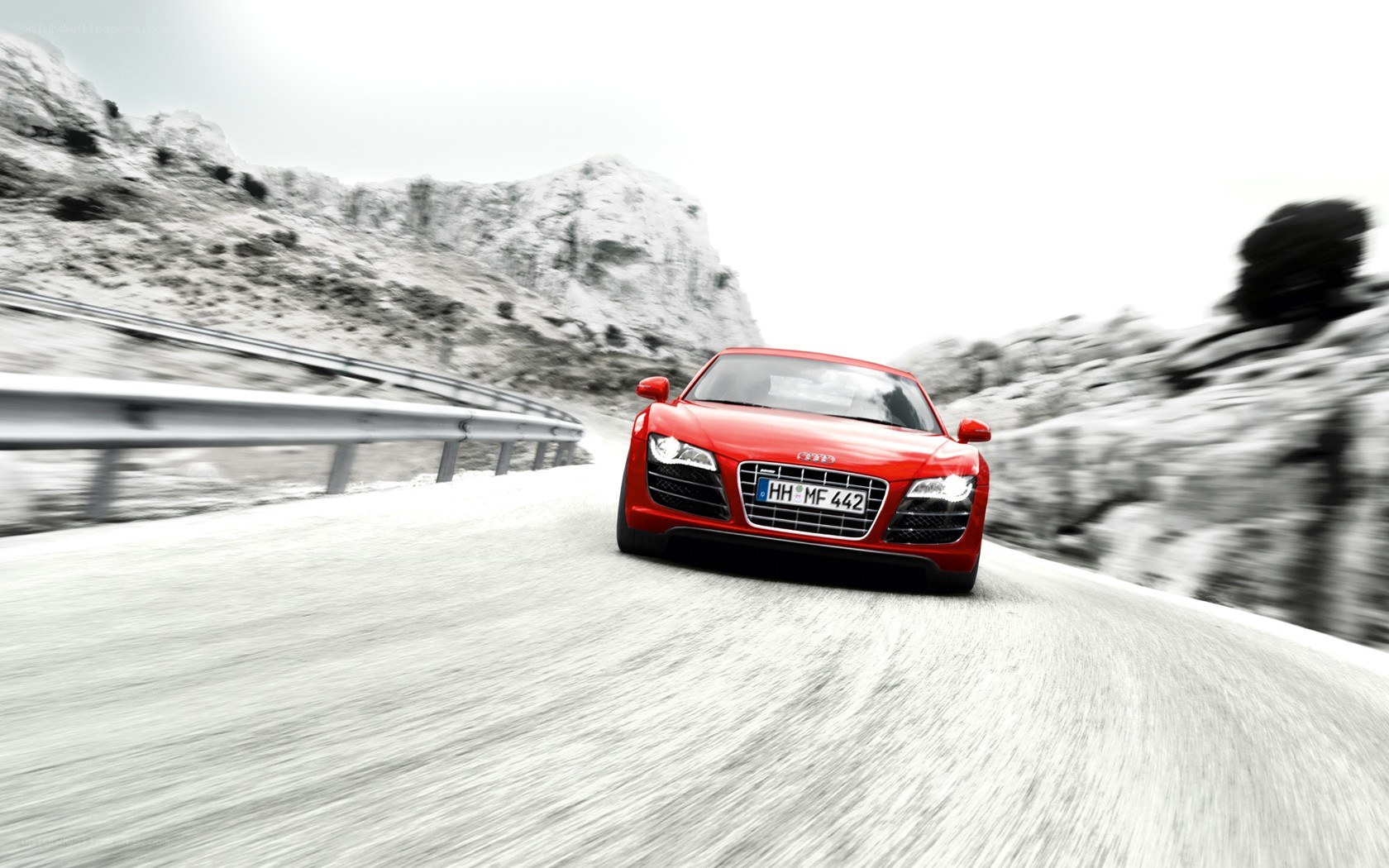 Red Audi on mountain road