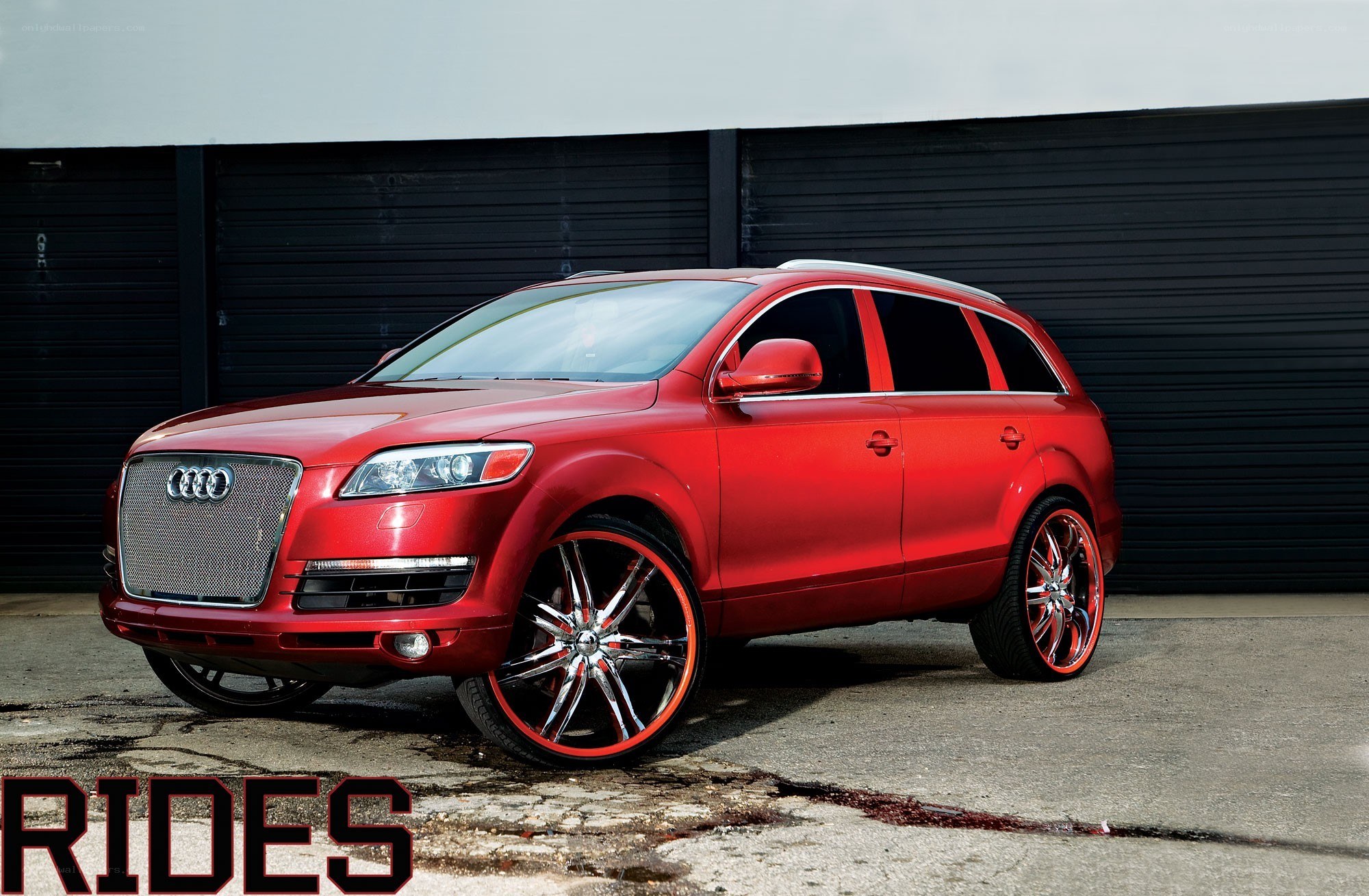 Red Audi Q7 with custom wheels