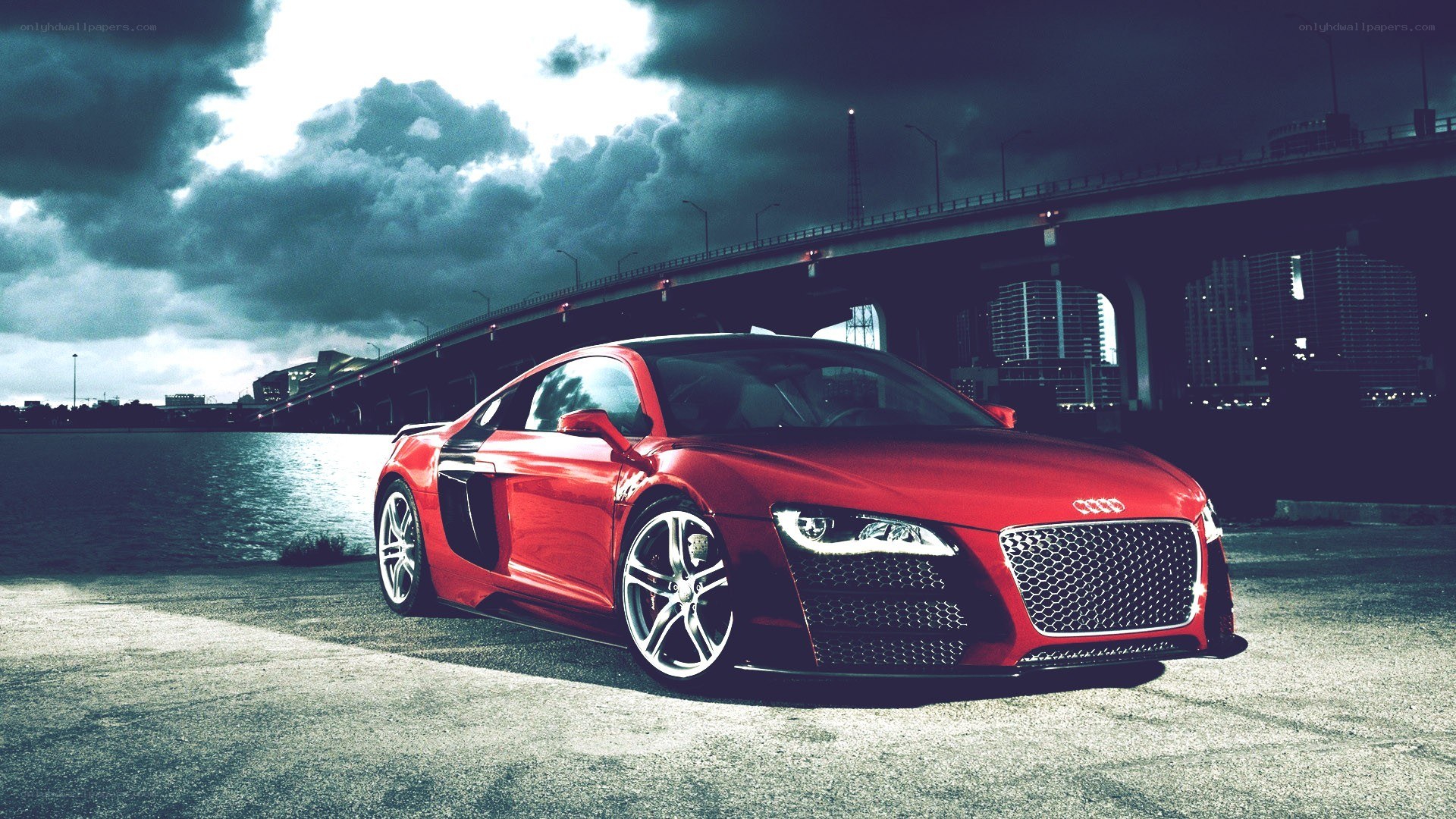 Red Audi R8 by a bridge
