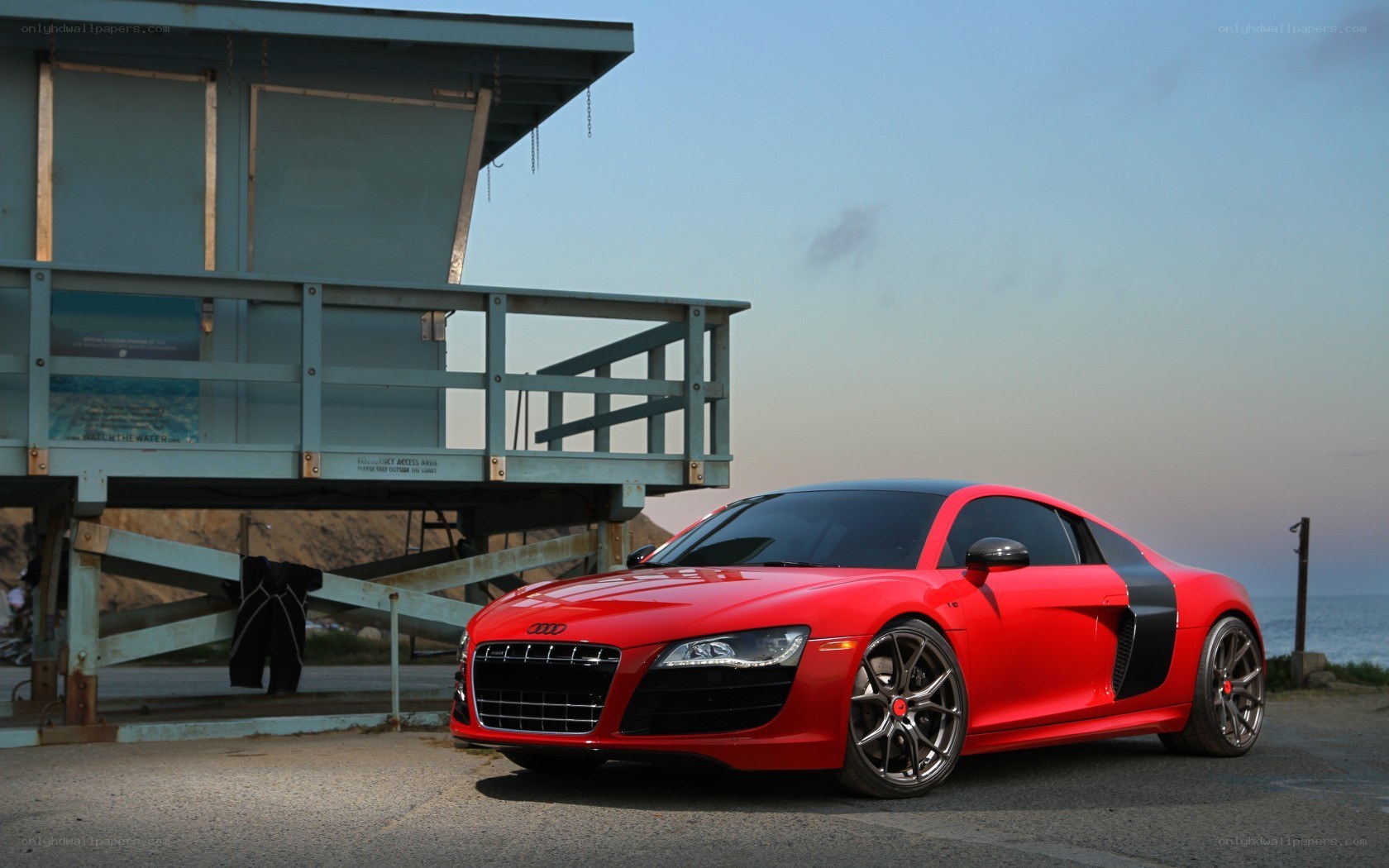 Red Audi R8 by lifeguard tower
