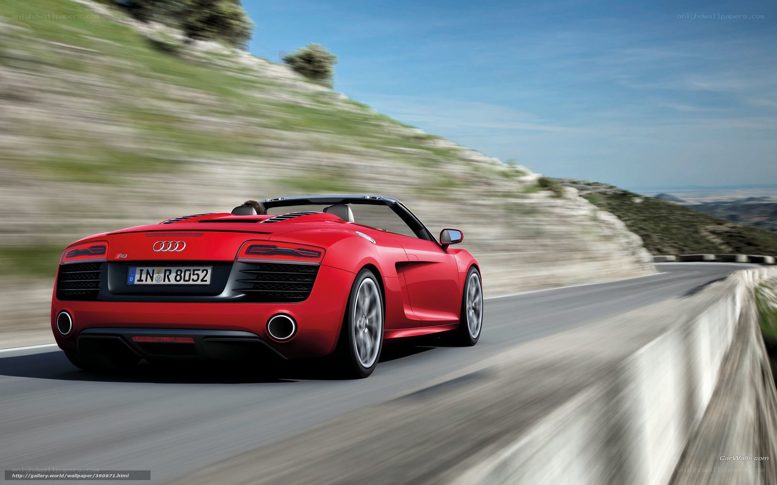 Red Audi R8 driving on a road