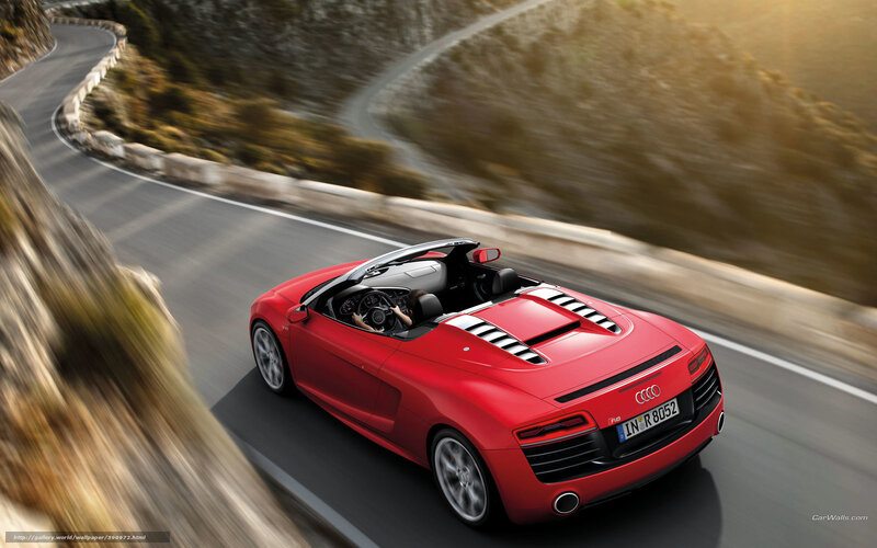 Red Audi R8 driving on mountain road
