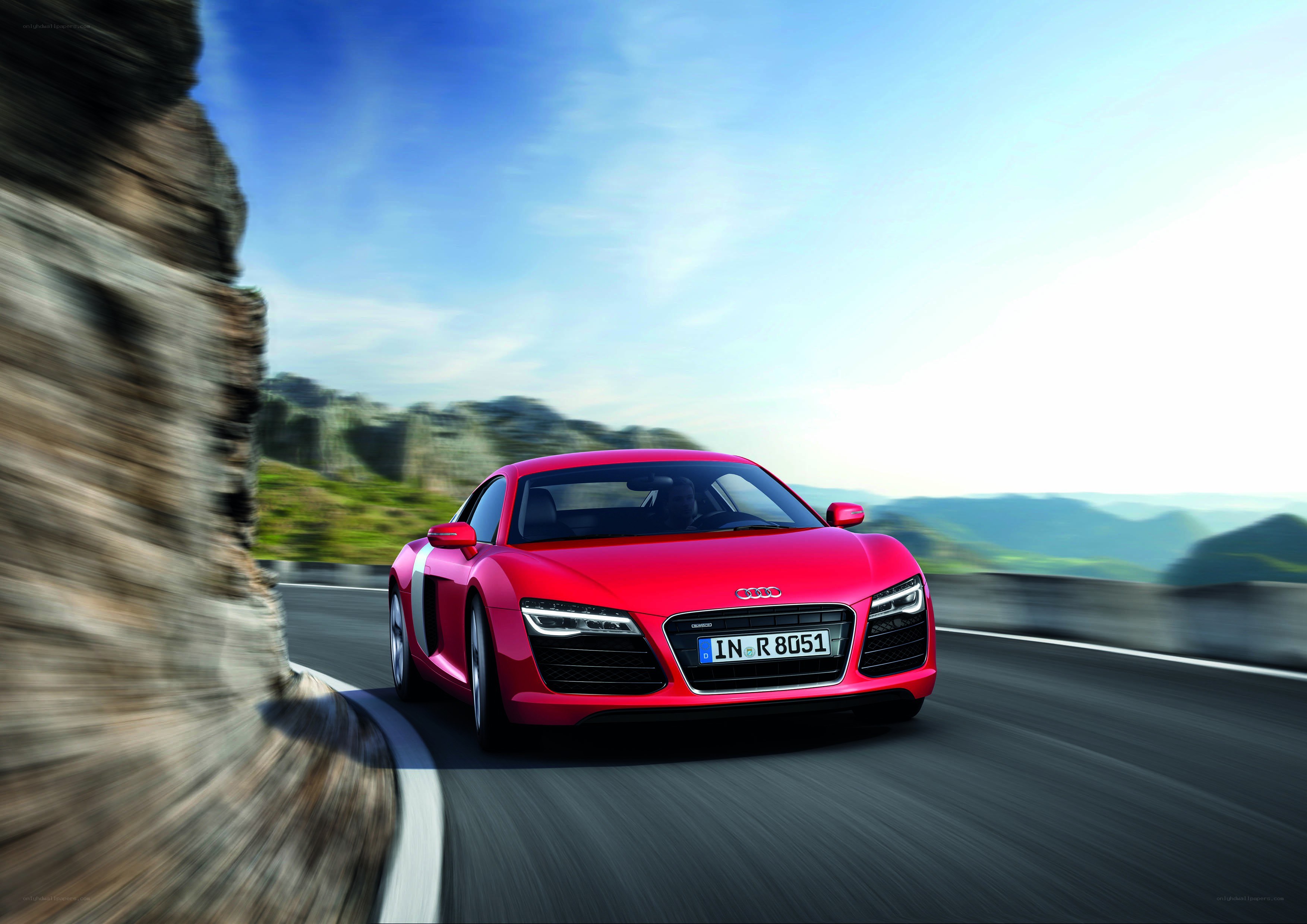 Red Audi R8 on mountain road