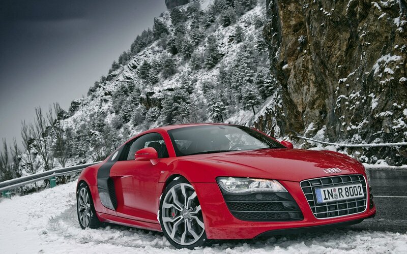 Red Audi R8 on snowy mountain road
