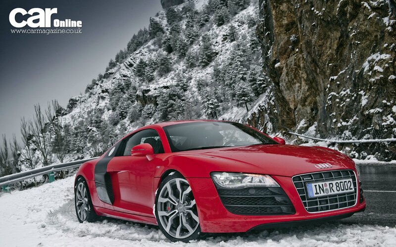 Red Audi R8 on snowy mountain road