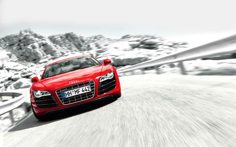 Red Audi R8 on snowy road