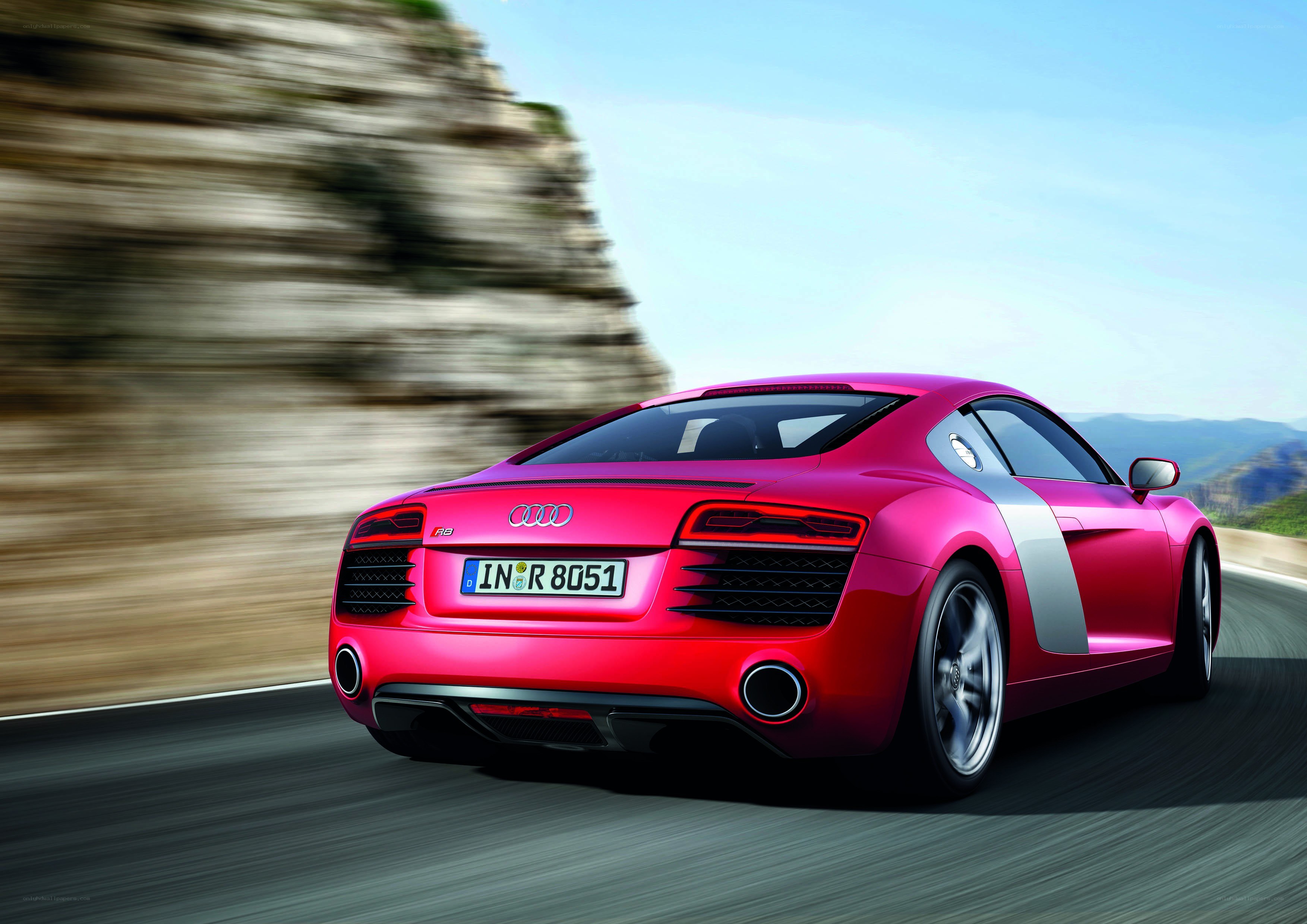Red Audi R8 speeding on road