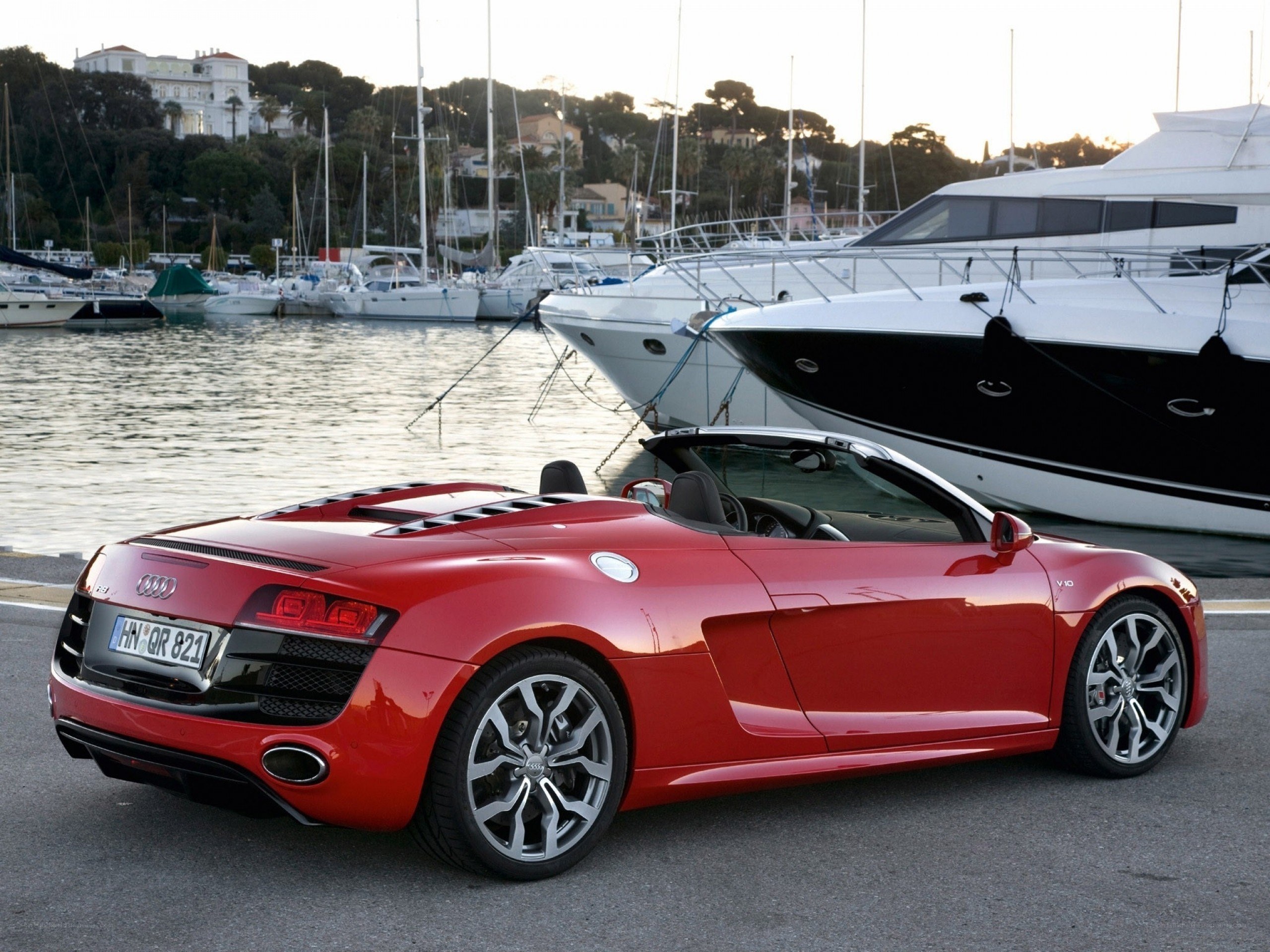 Red Audi R8 Spyder at marina