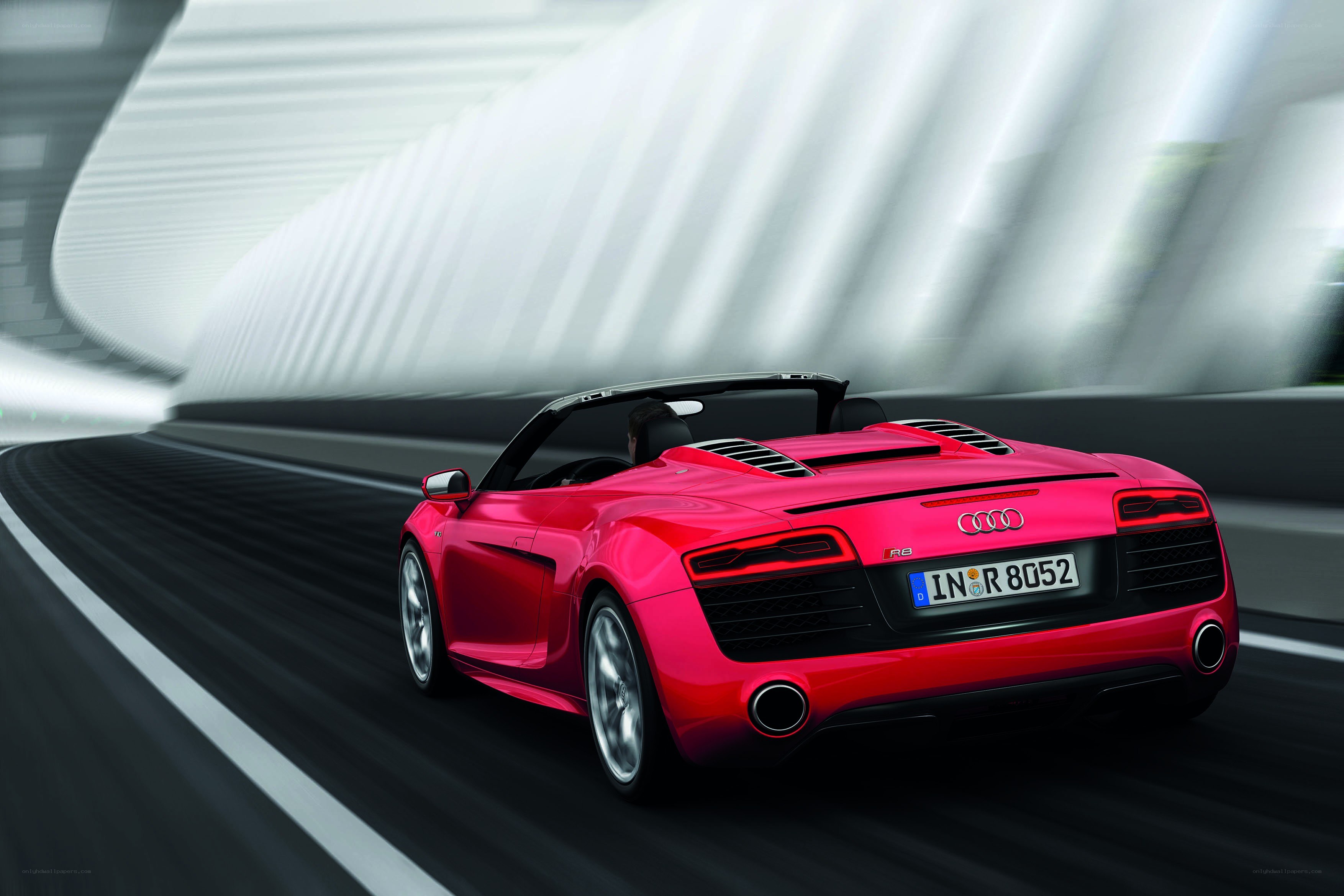 Red Audi R8 Spyder in motion