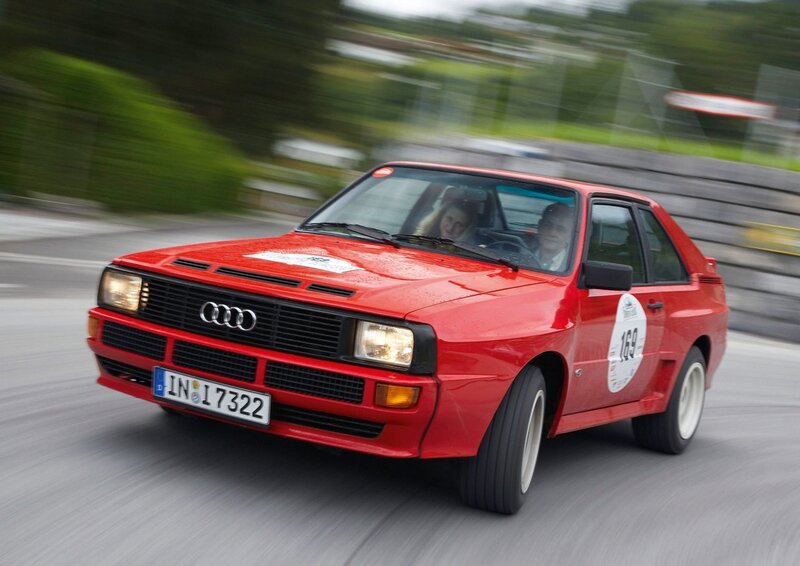 Red Audi rally car in motion