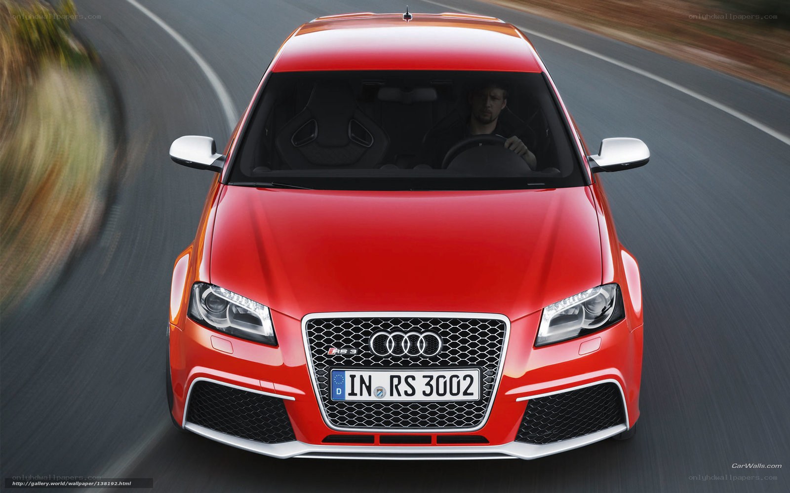 Red Audi RS 3 in motion