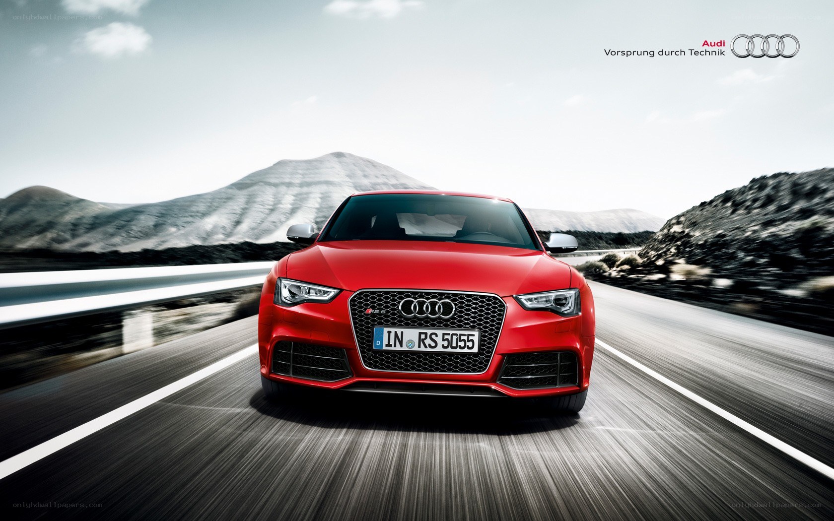 Red Audi RS on a mountain road
