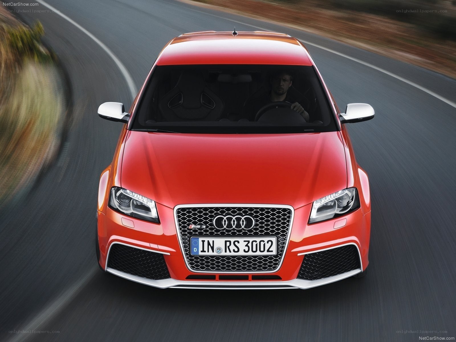 Red Audi RS3 in motion