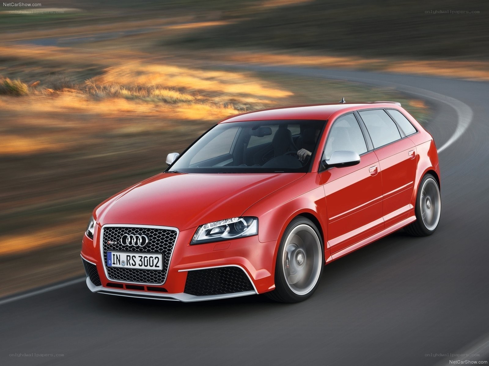 Red Audi RS3 in motion