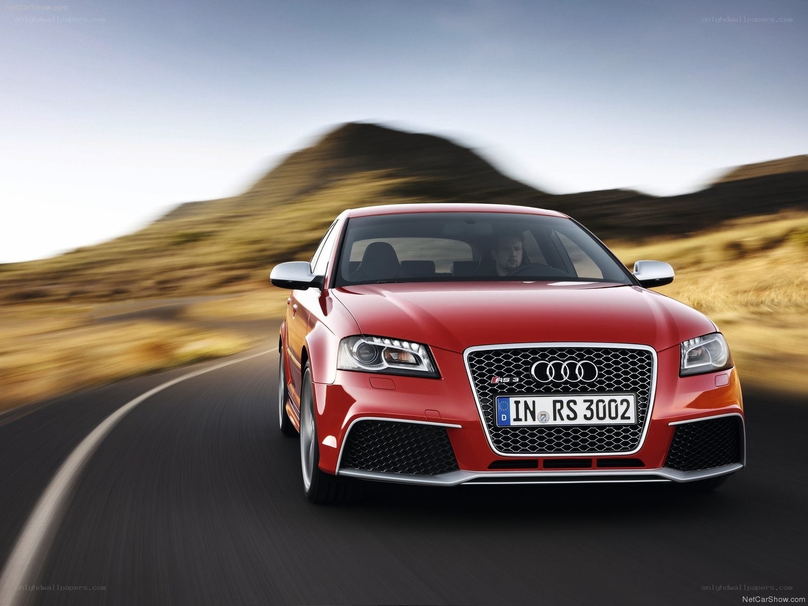 Red Audi RS3 in motion