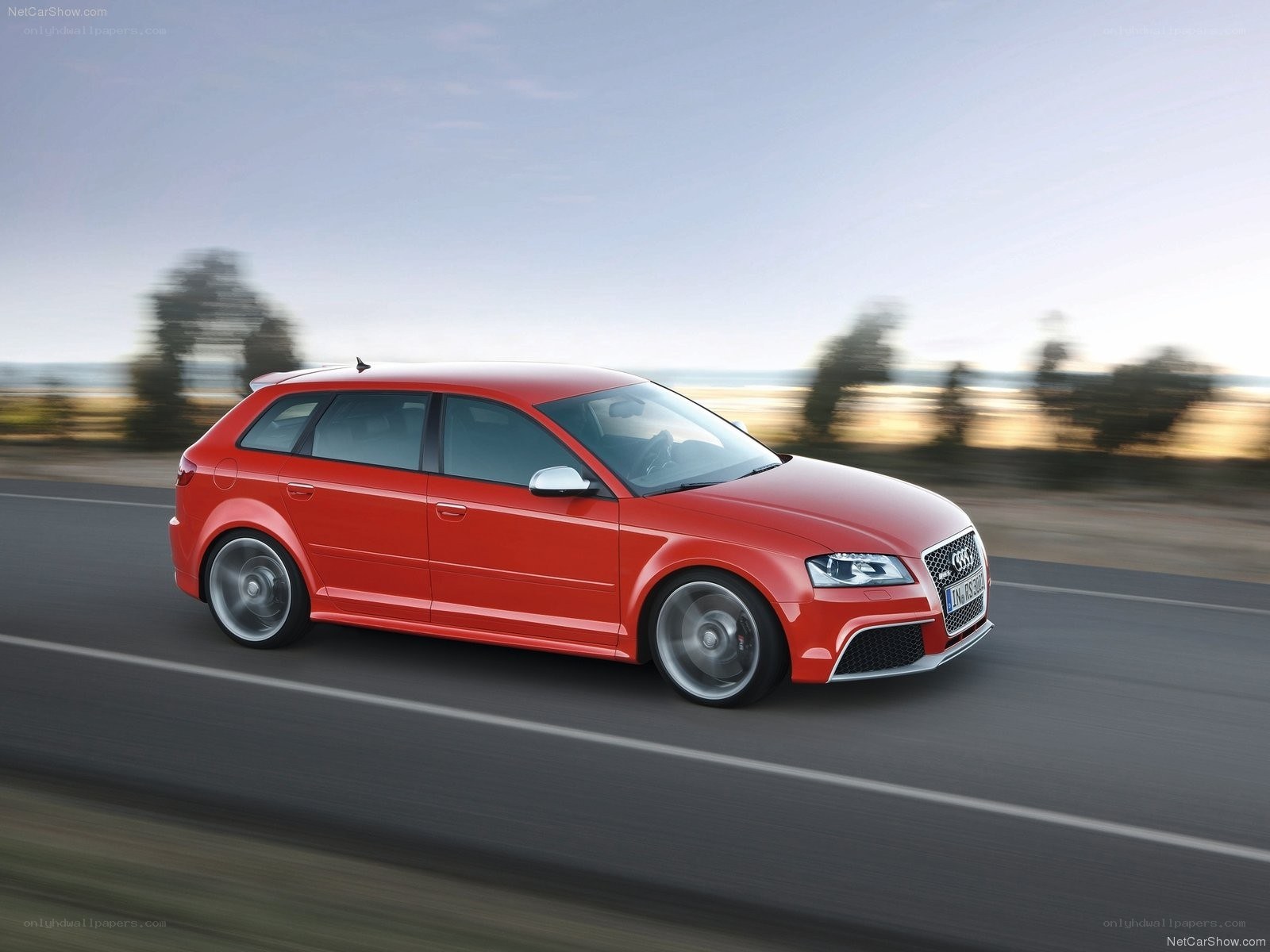 Red Audi RS3 in motion
