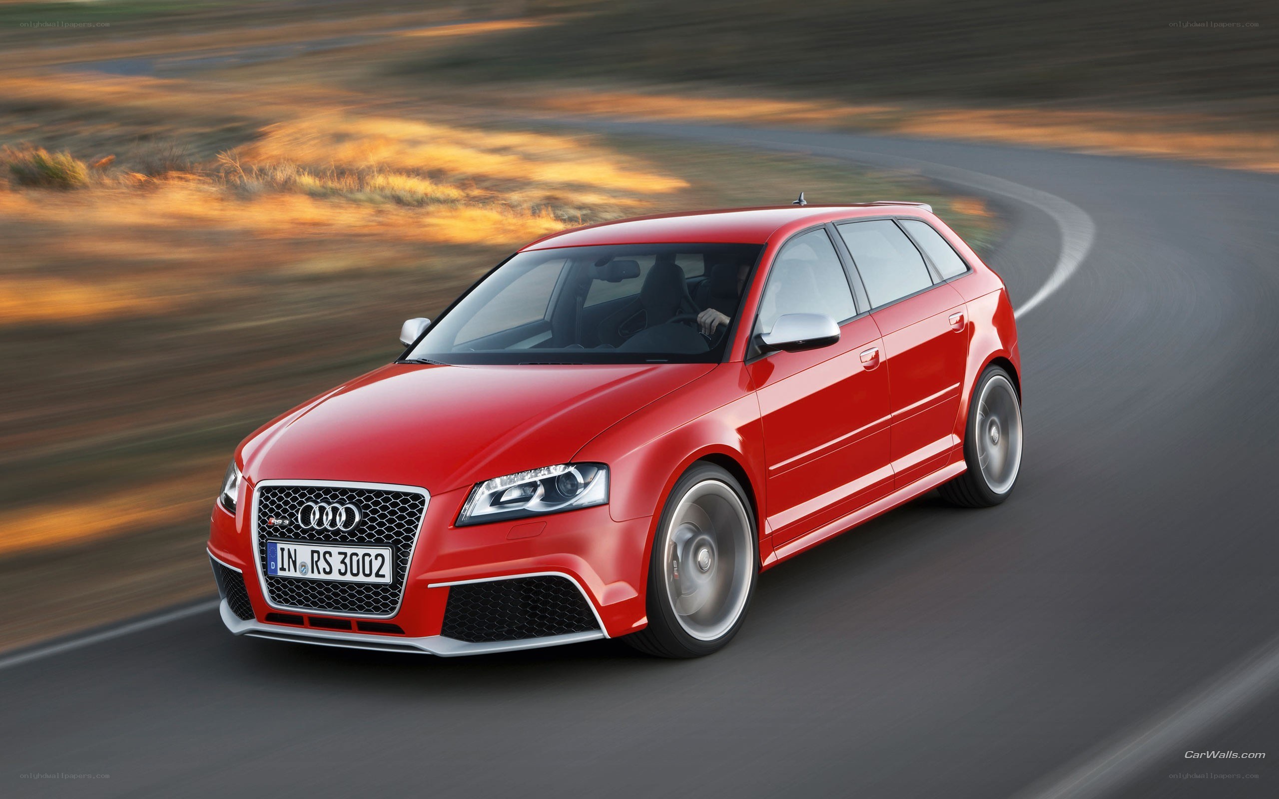 Red Audi RS3 in motion