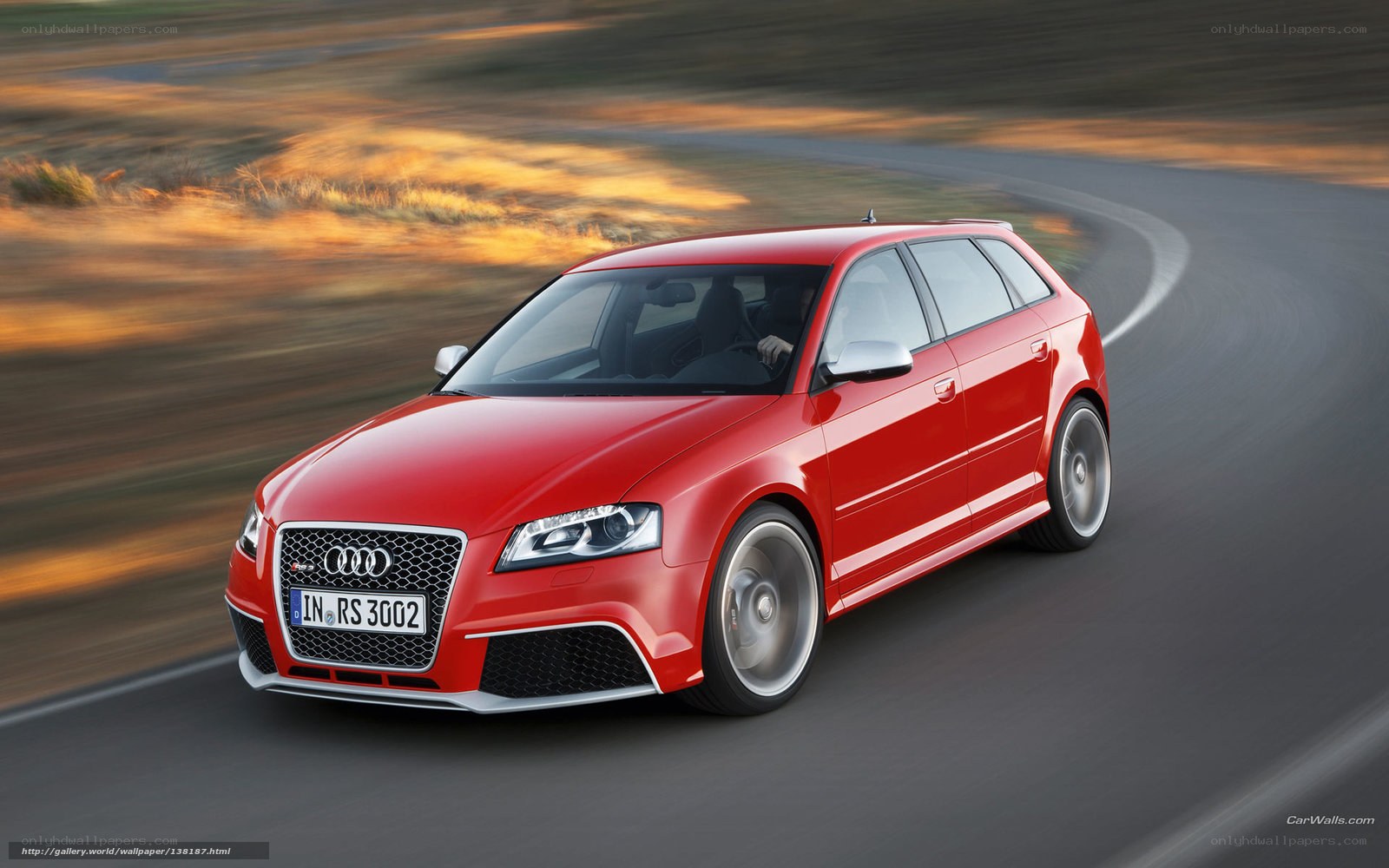 Red Audi RS3 in motion