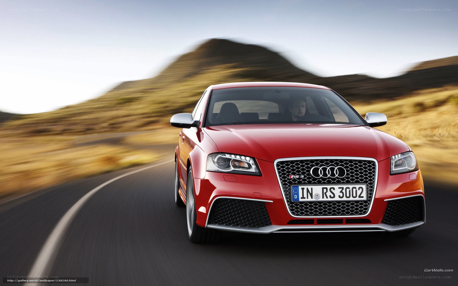 Red Audi RS3 on a winding road