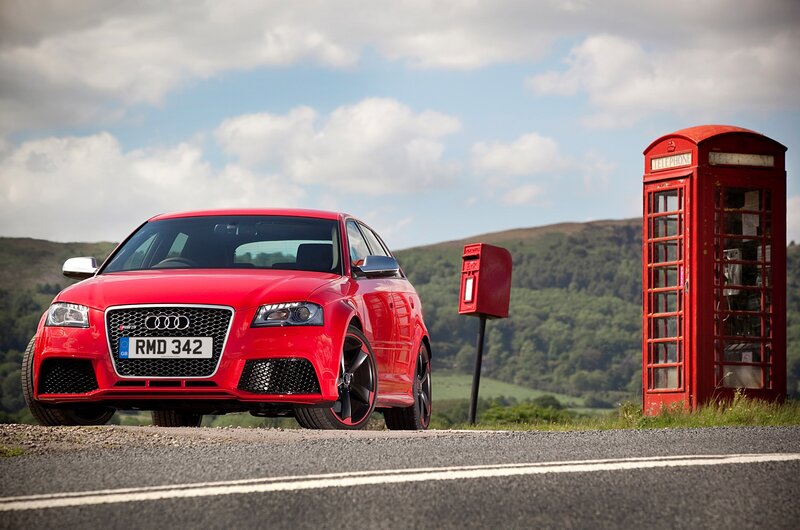 Red Audi RS3 on country road