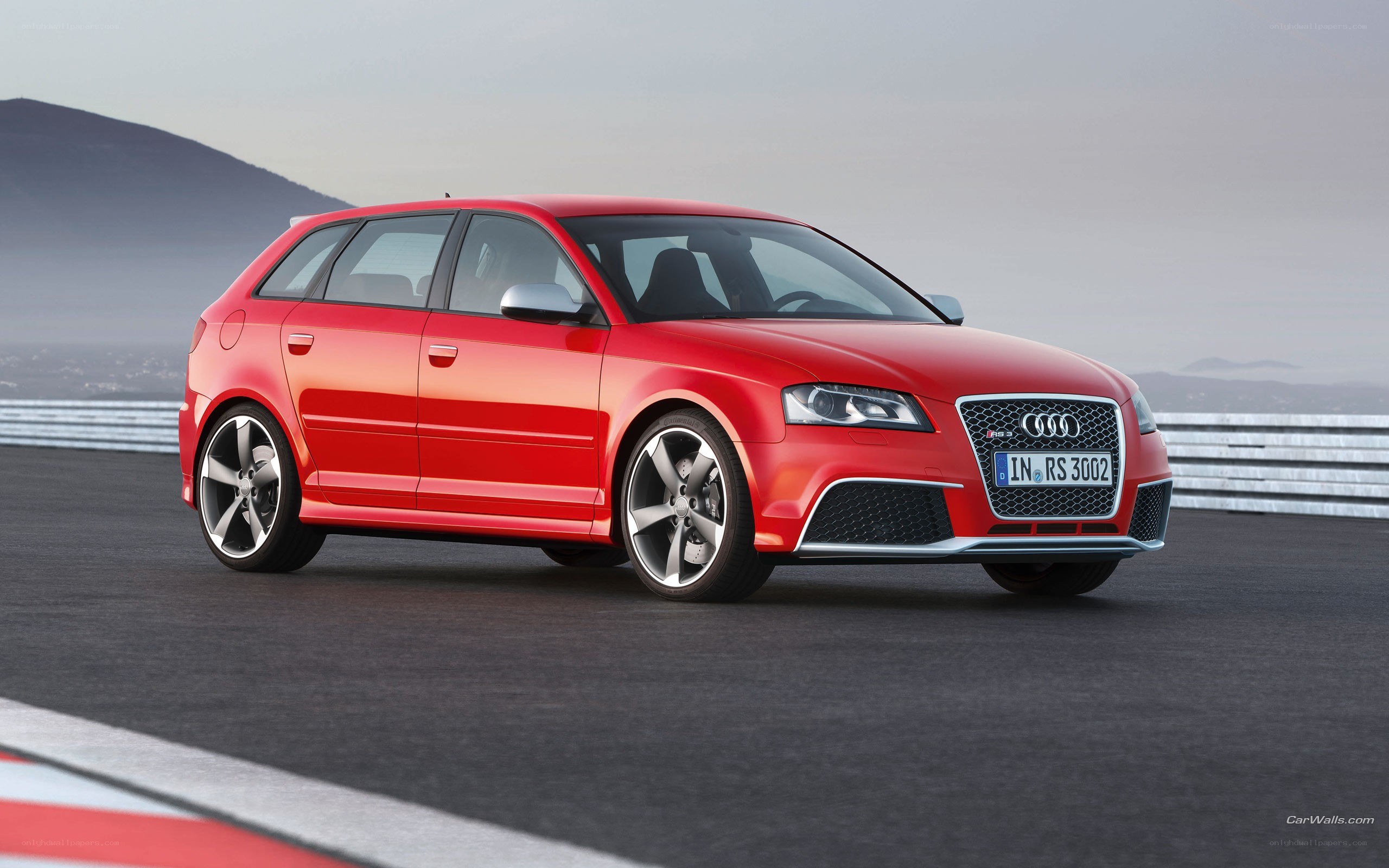 Red Audi RS3 on racetrack