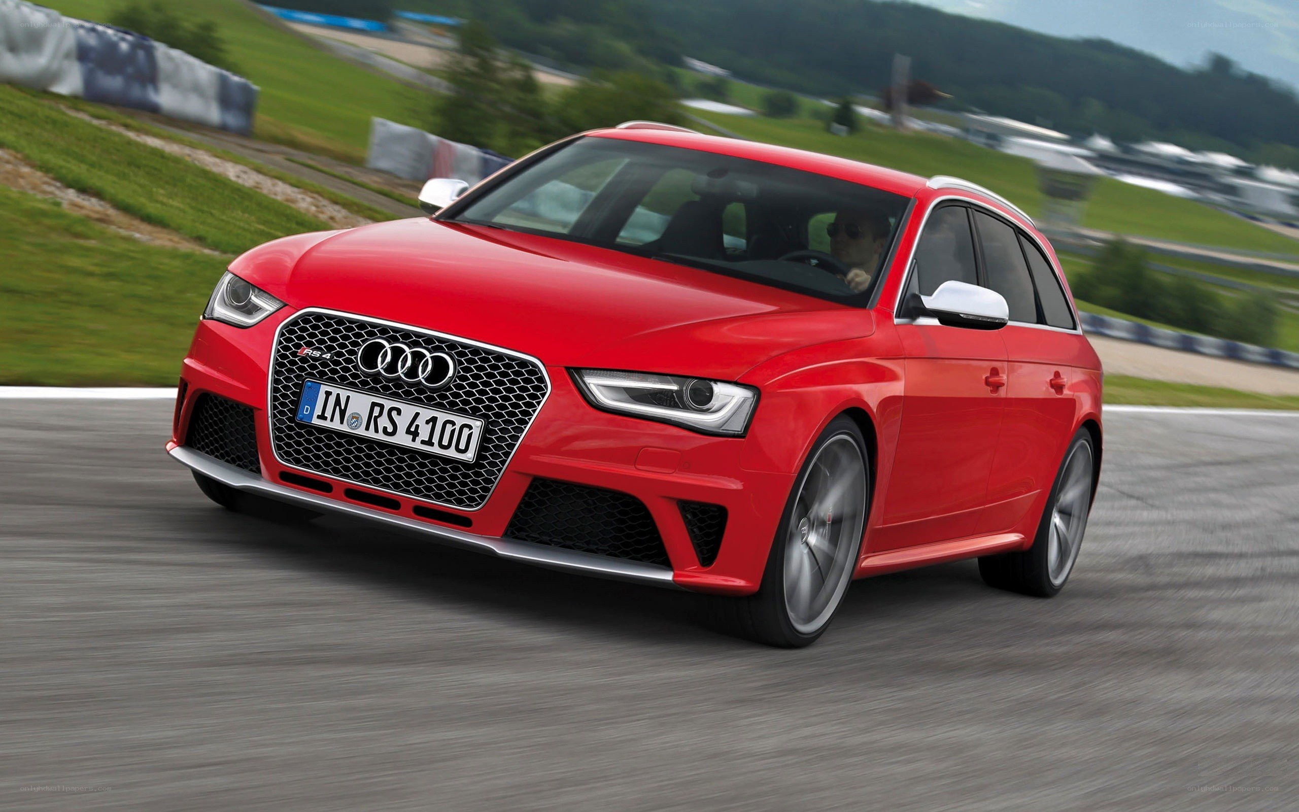 Red Audi RS4 on a racetrack