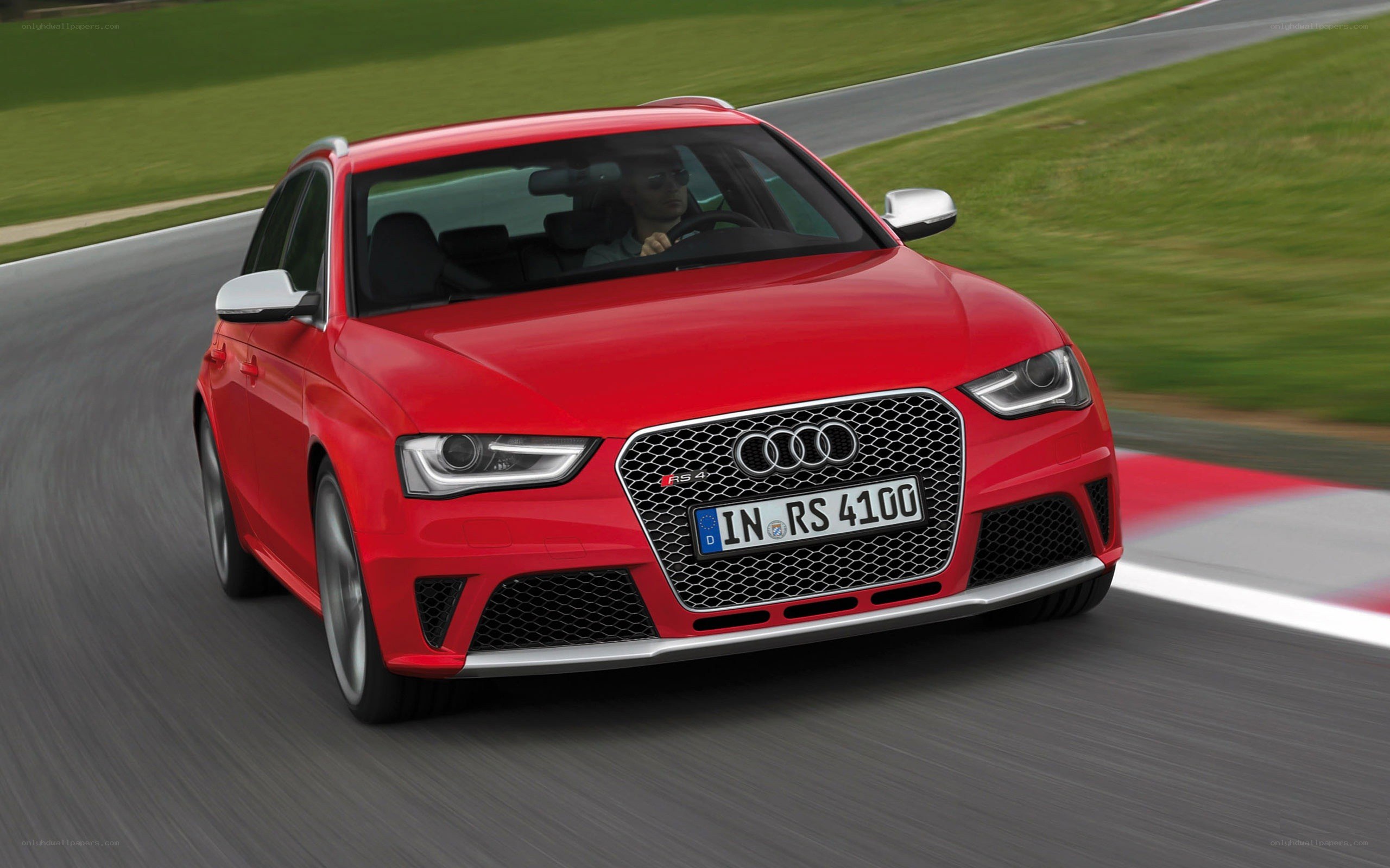 Red Audi RS4 on a racetrack