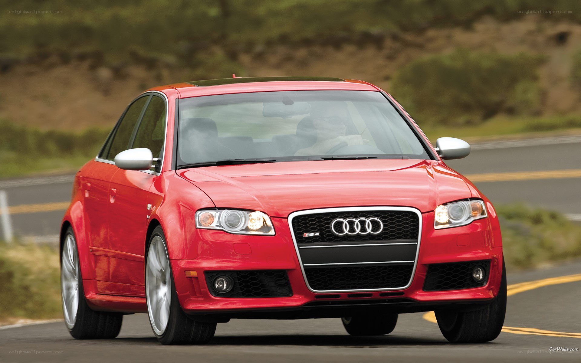 Red Audi RS4 on a road
