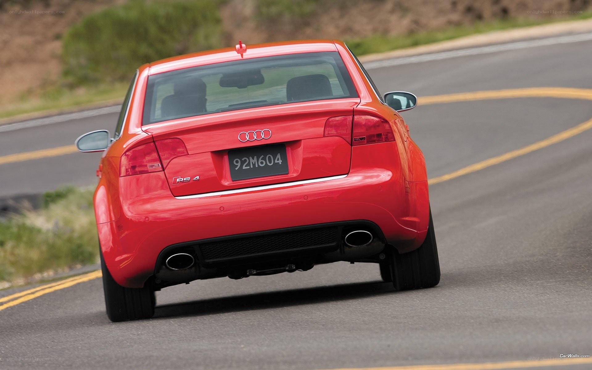 Red Audi RS4 on a winding road