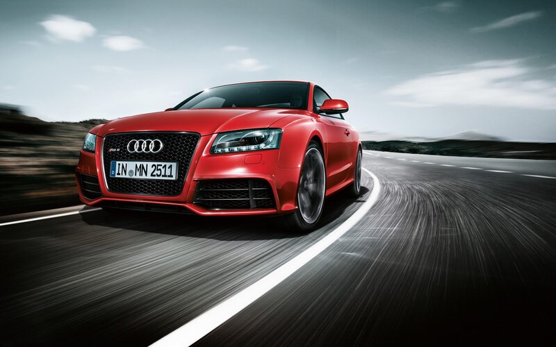 Red Audi RS5 on a winding road