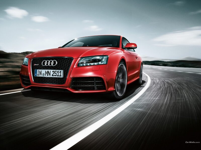 Red Audi RS5 on a winding road