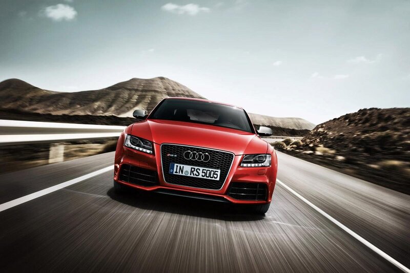 Red Audi RS5 on a winding road