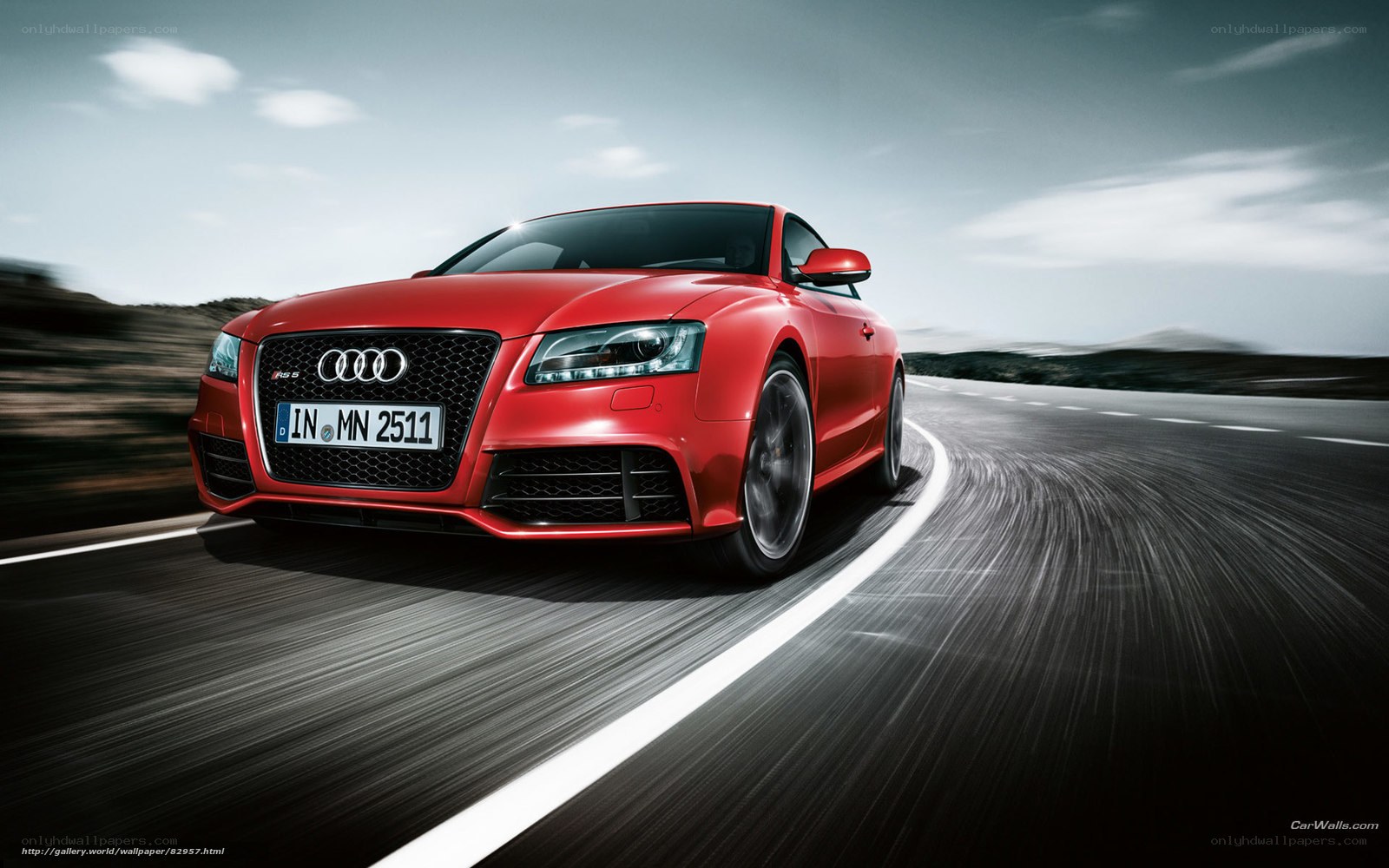 Red Audi RS5 on a winding road