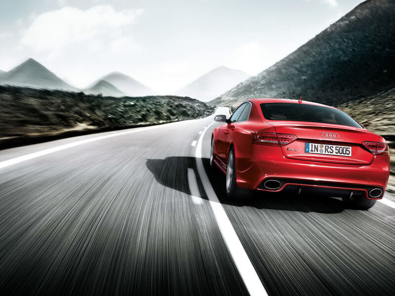 Red Audi RS5 on mountain road