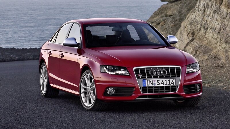 Red Audi S4 on coastal road