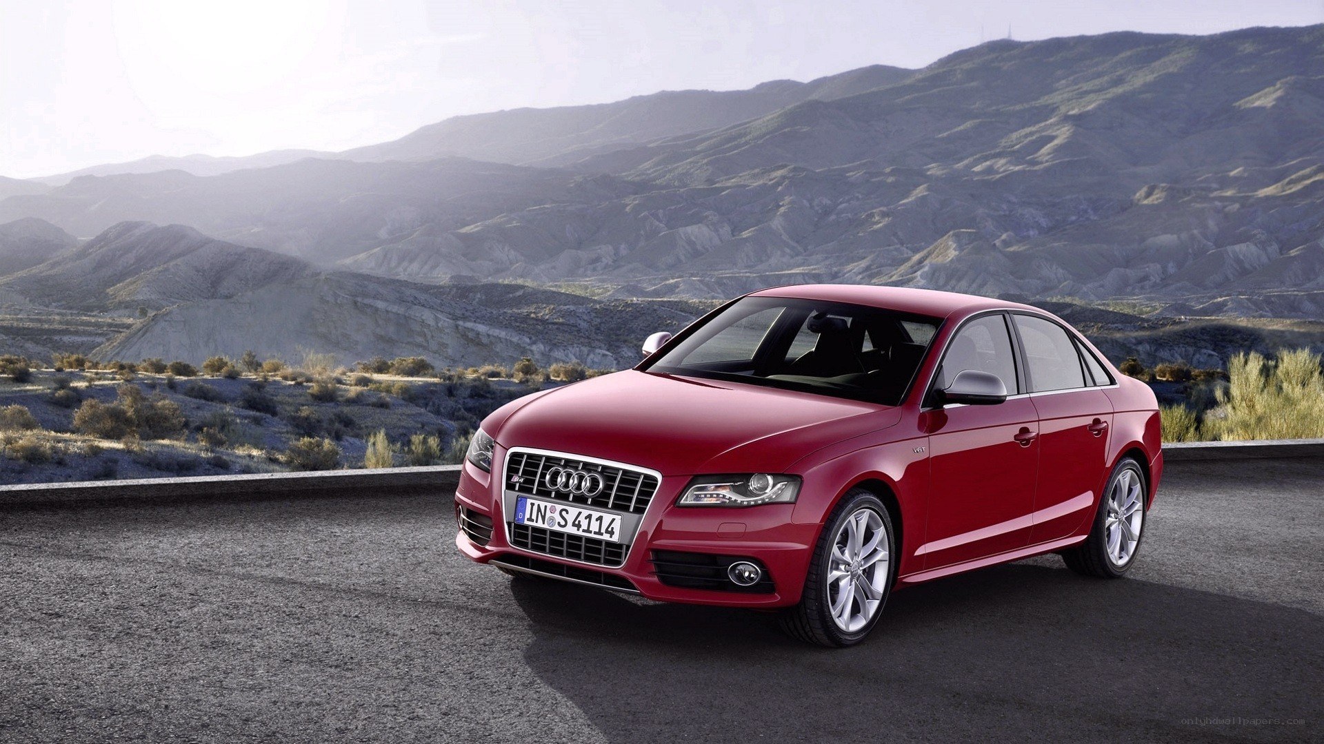 Red Audi S4 on mountain road