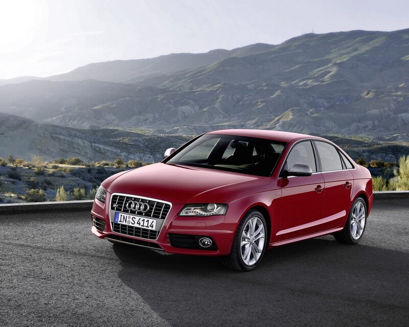 Red Audi S4 sedan on mountain road
