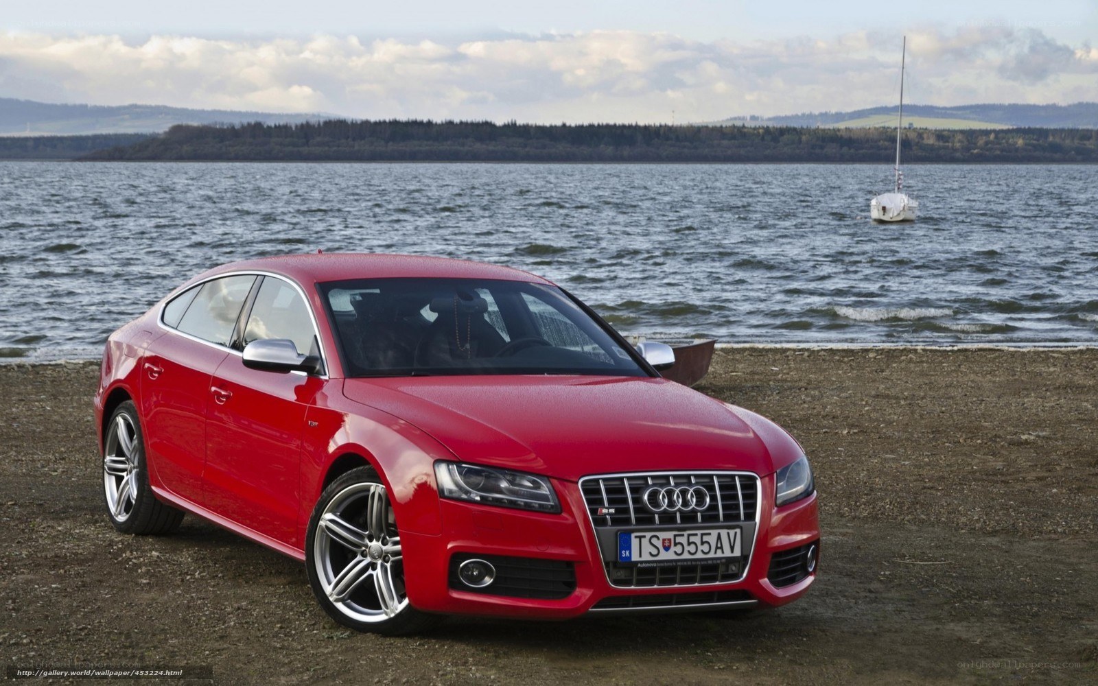 Red Audi S7 by the lake