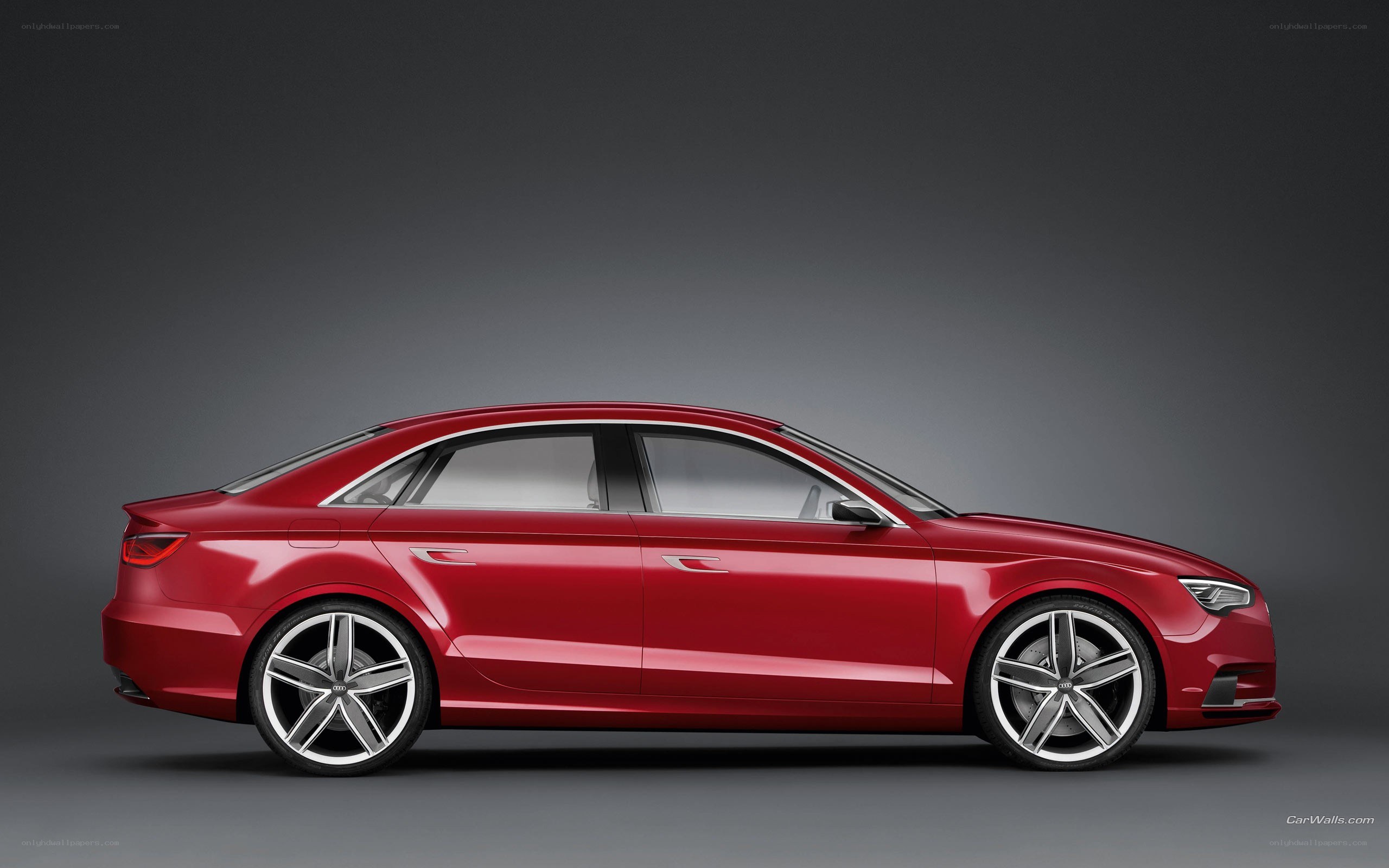 red audi sedan side profile