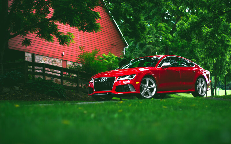 Red Audi sports car in a rural setting