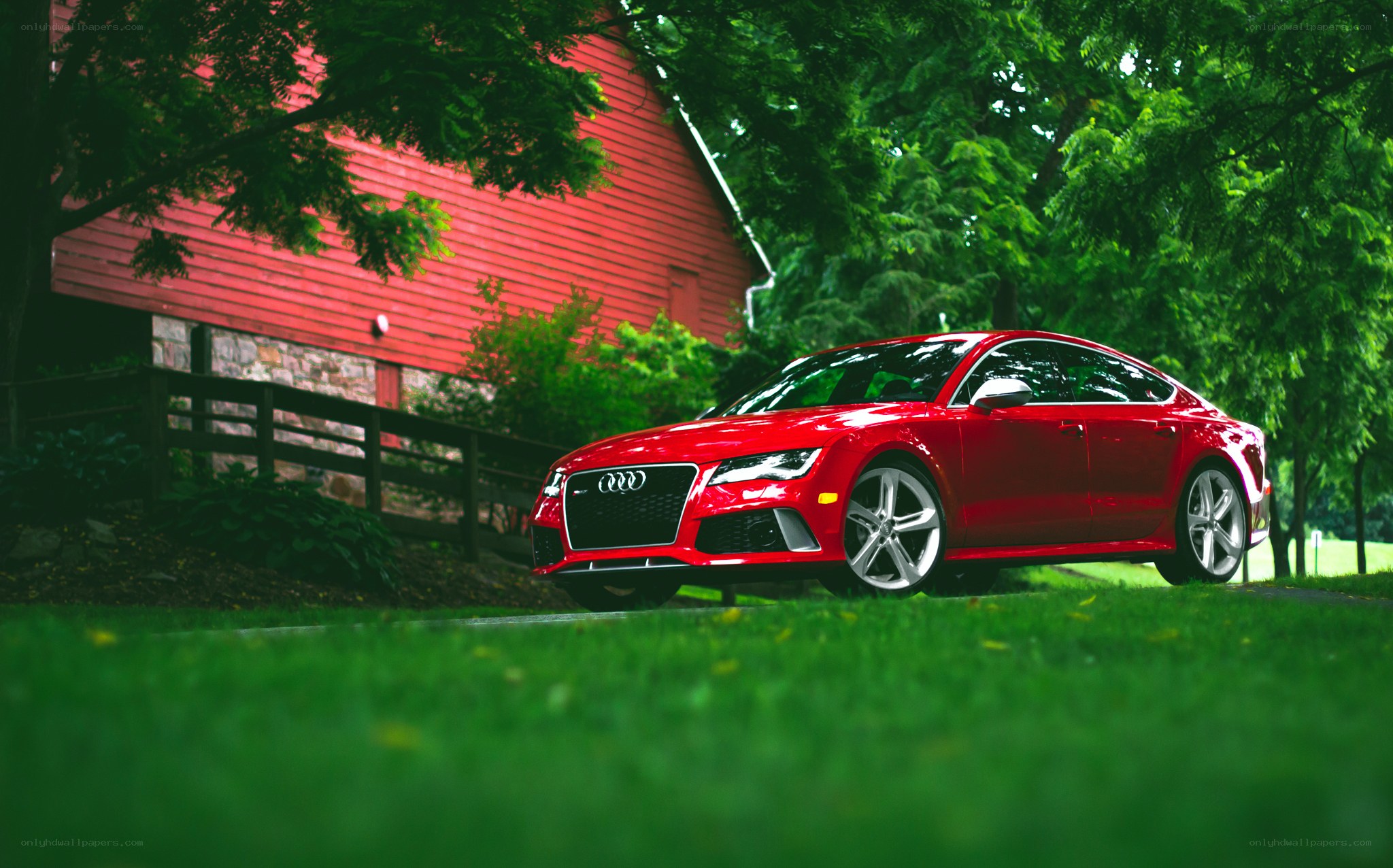 Red Audi sports car in a rural setting