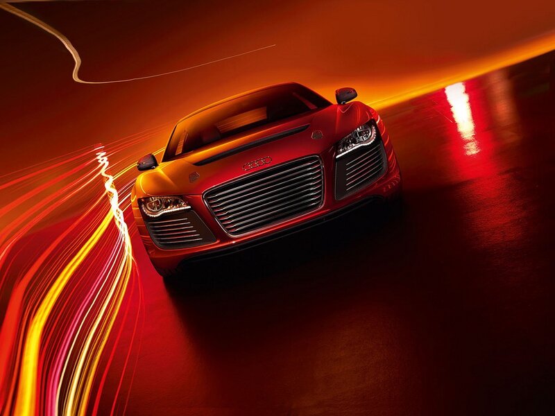 Red Audi sports car in motion