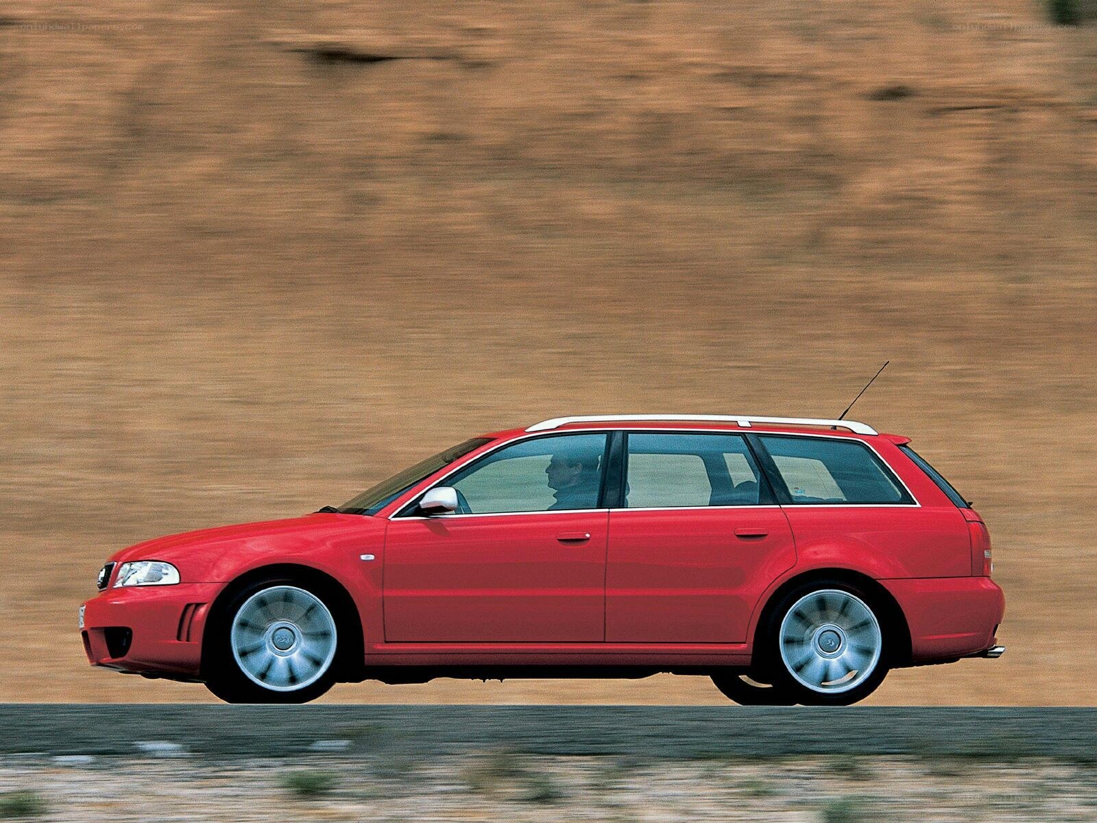 red audi station wagon in motion