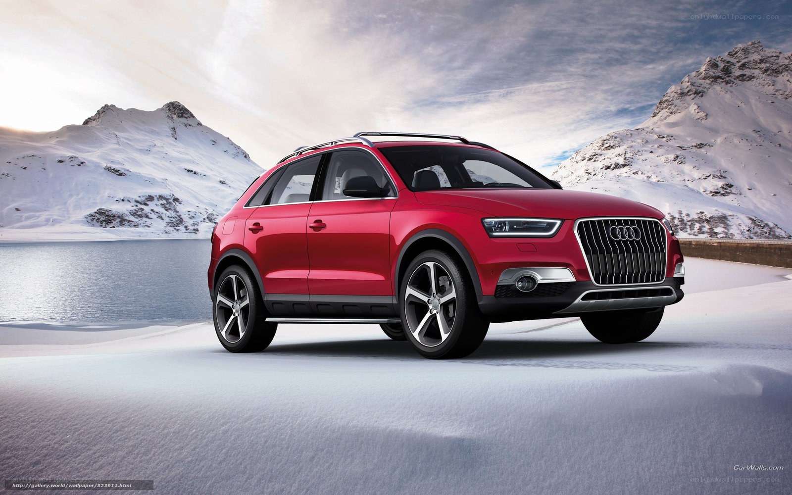 Red Audi SUV in snowy mountains
