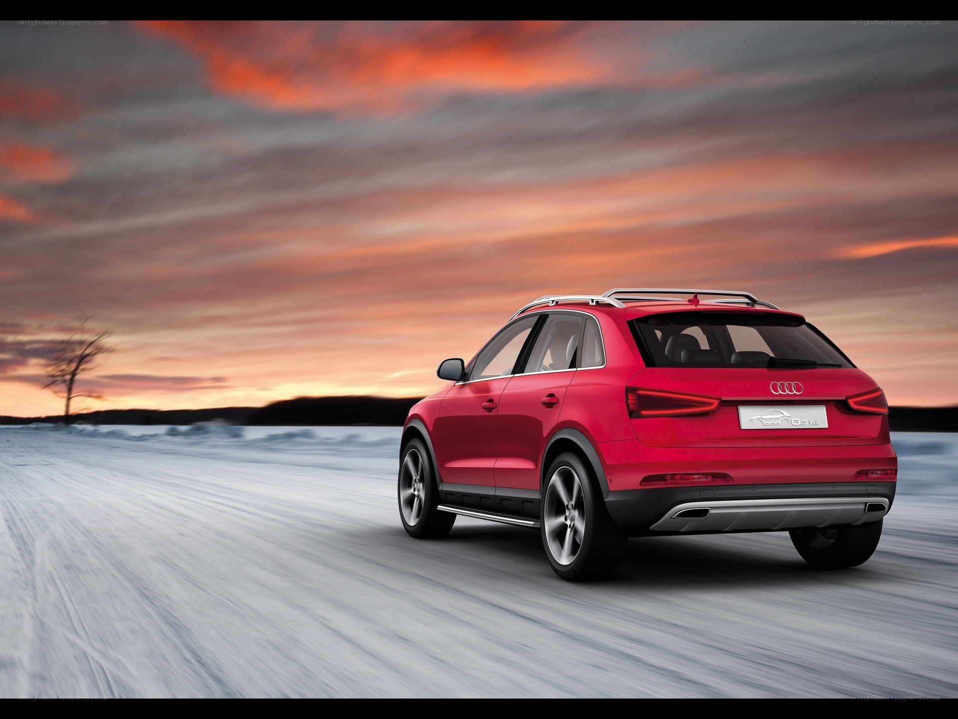Red Audi SUV on snowy road