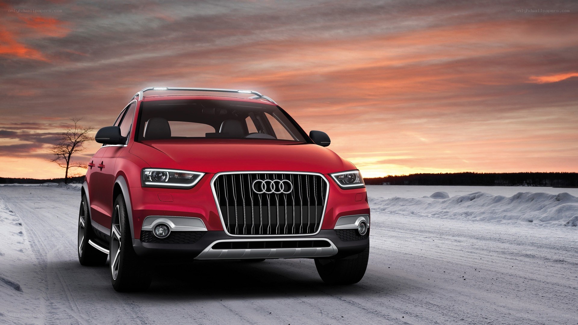 Red Audi SUV on snowy road