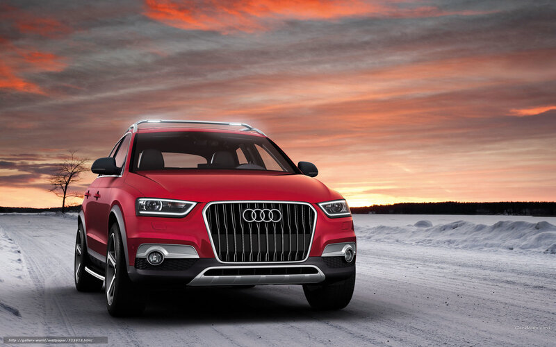 Red Audi SUV on snowy road